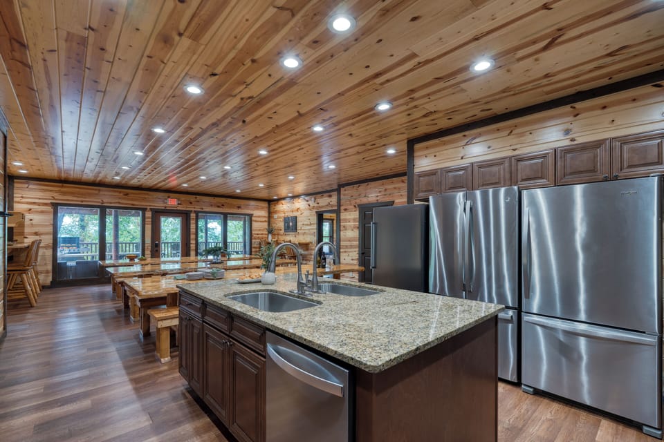 Multiple stoves, microwaves, and refrigerators in the kitchen for your group. 