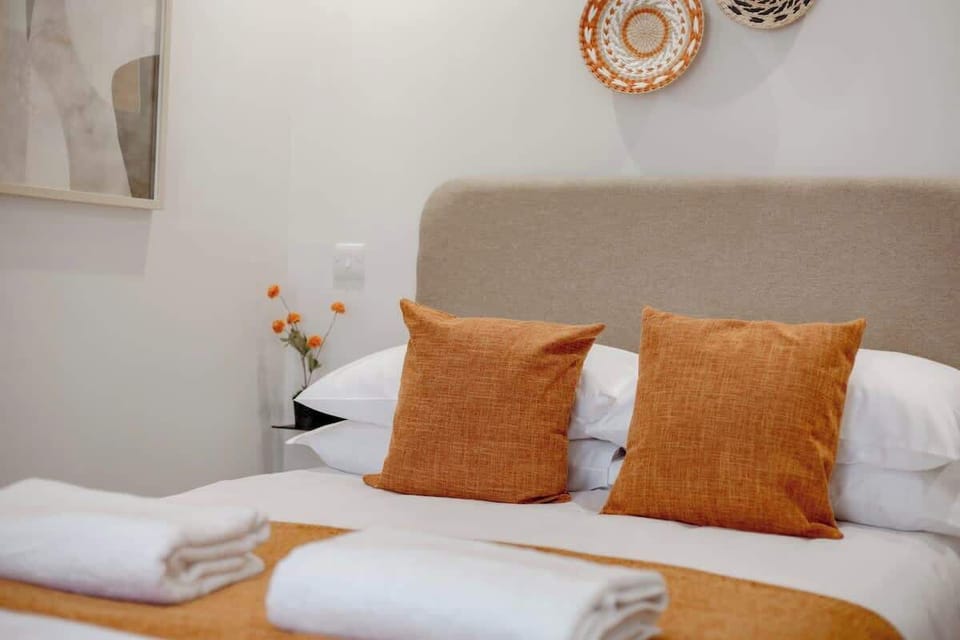 Fresh towels and pillows on the bed