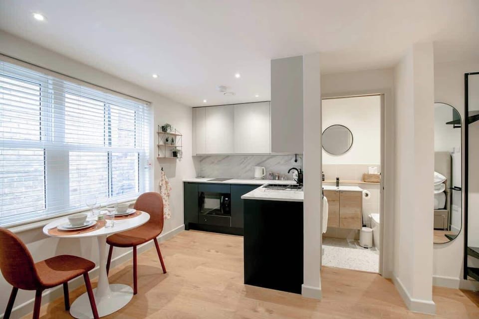 Dining table and chairs, full kitchen, and full bathroom