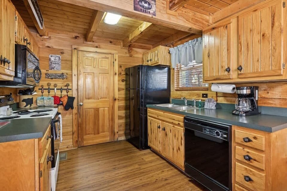 Firefly Holler’s kitchen offers everything you need—set in a timeless, wood-paneled space.
