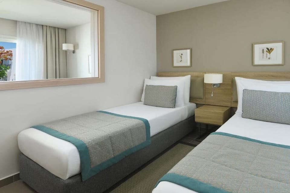 Drift off easily with flexible twin beds and soft textiles.