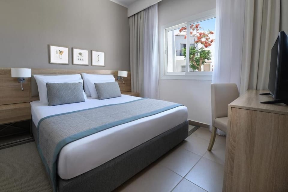 Unwind in crisp linens and wake to sunlit views.