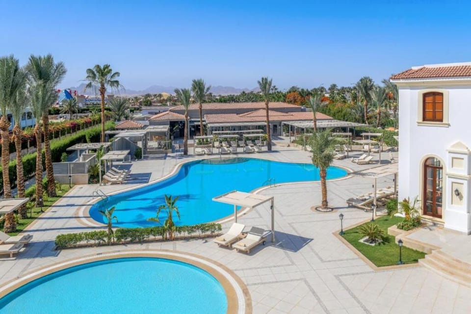 Soak up sunshine beside the expansive lagoon-style pool oasis.