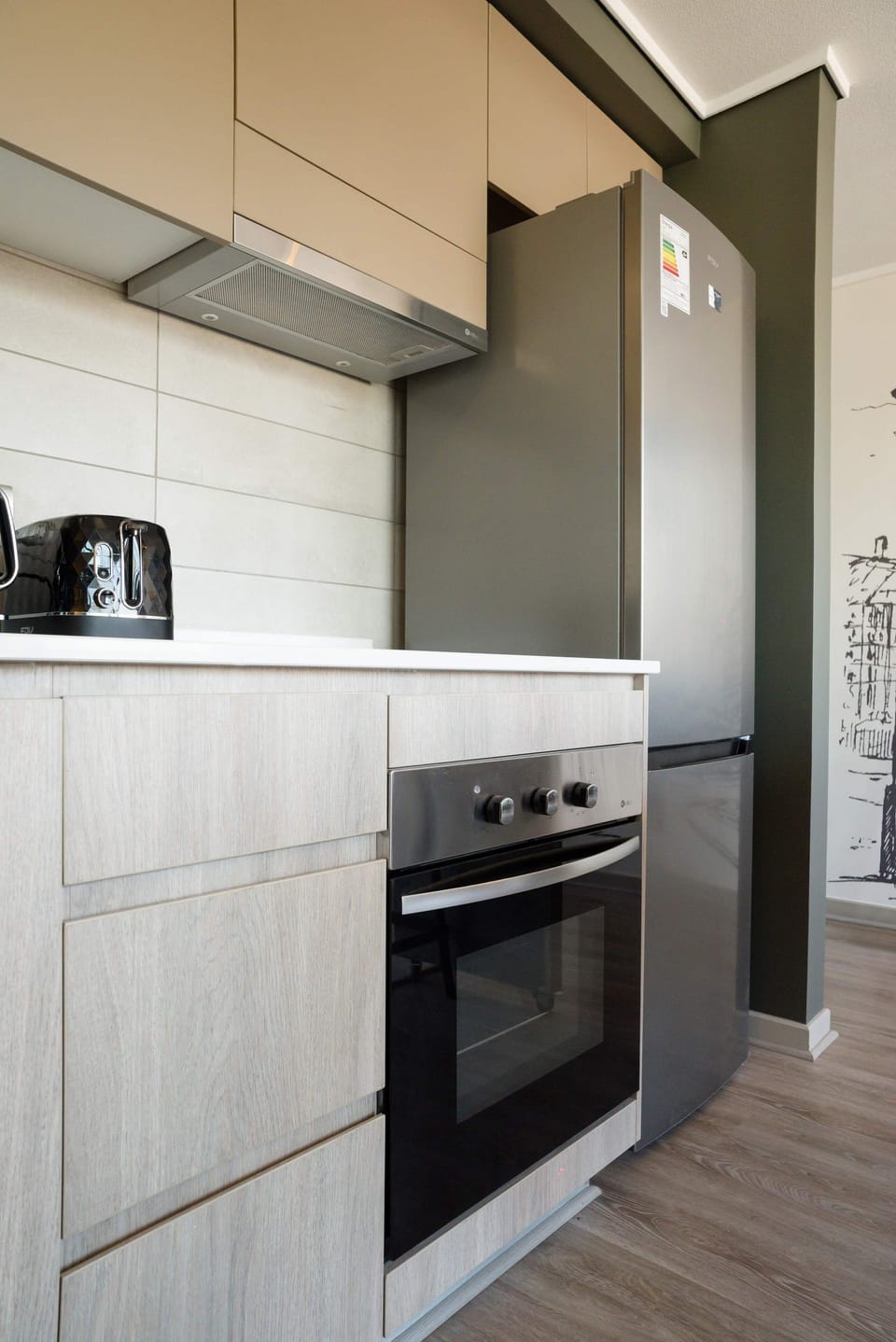 Sleek and modern kitchen with stainless steel appliances, perfect for preparing meals during your stay.