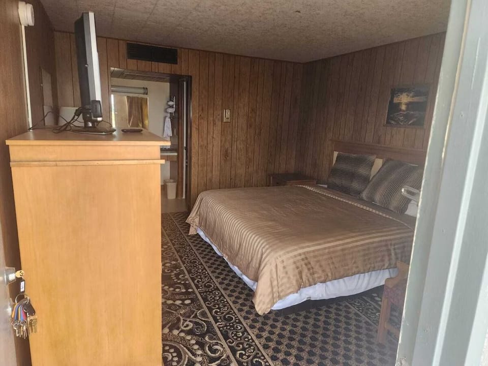 Step inside and settle into a warm, wood-paneled retreat.