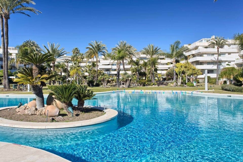 Large private pool with island and dedicated sunbeds