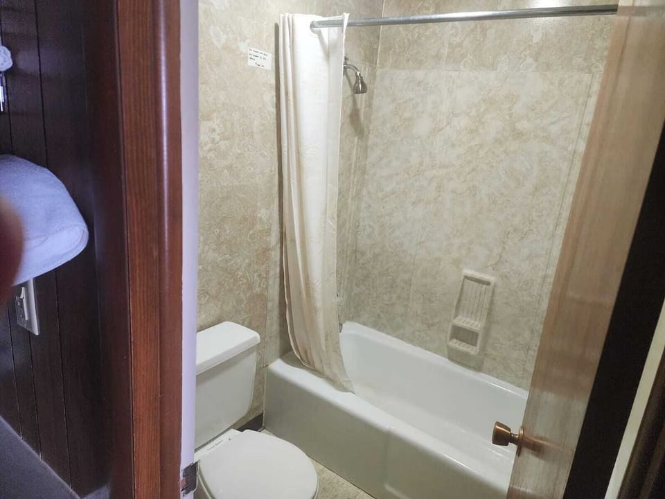 Refresh with a soothing shower in a clean, classic tub.