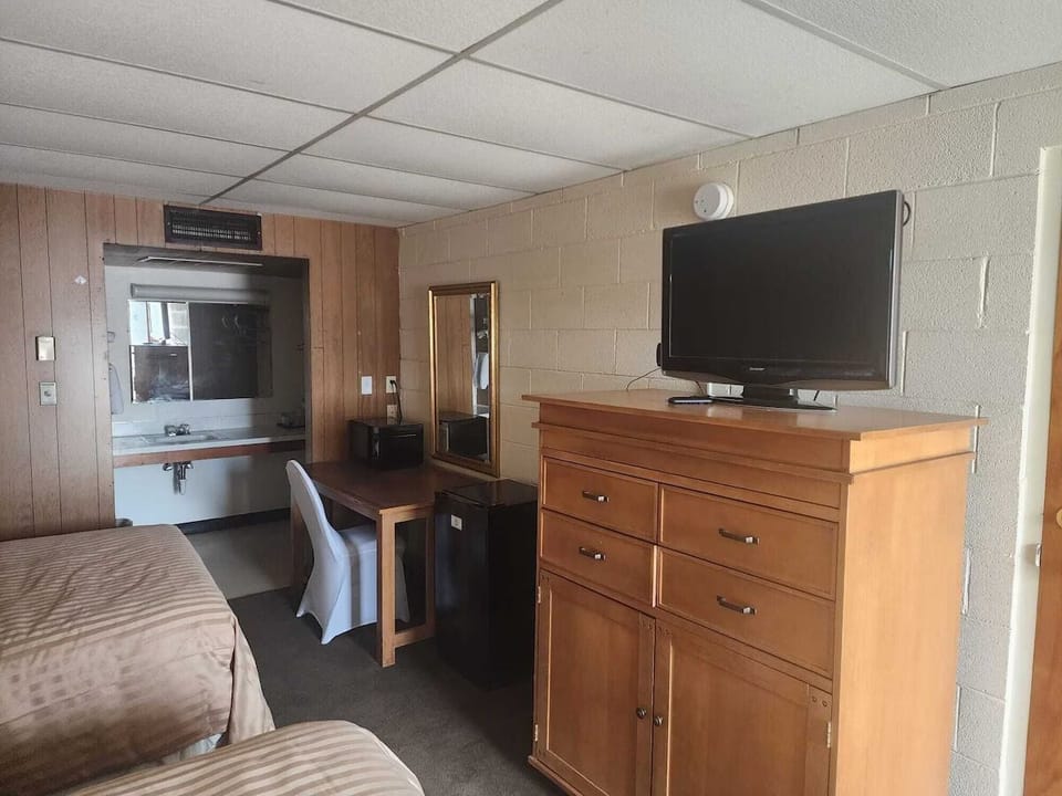 Settle in with comfy beds, TV entertainment, and desk space.