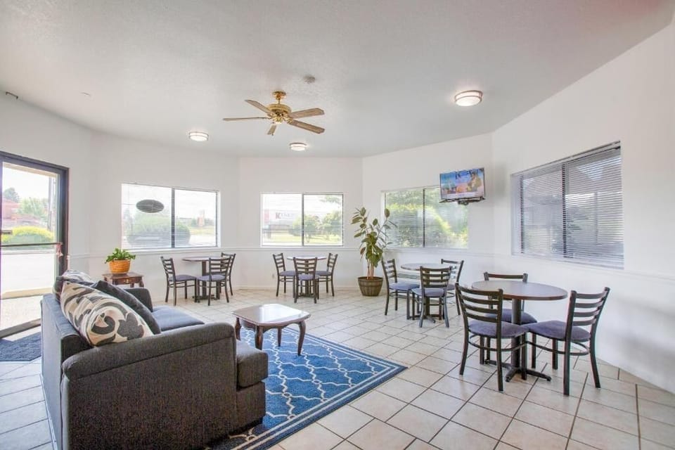 Unwind in a sunny lounge with casual seating and TV.