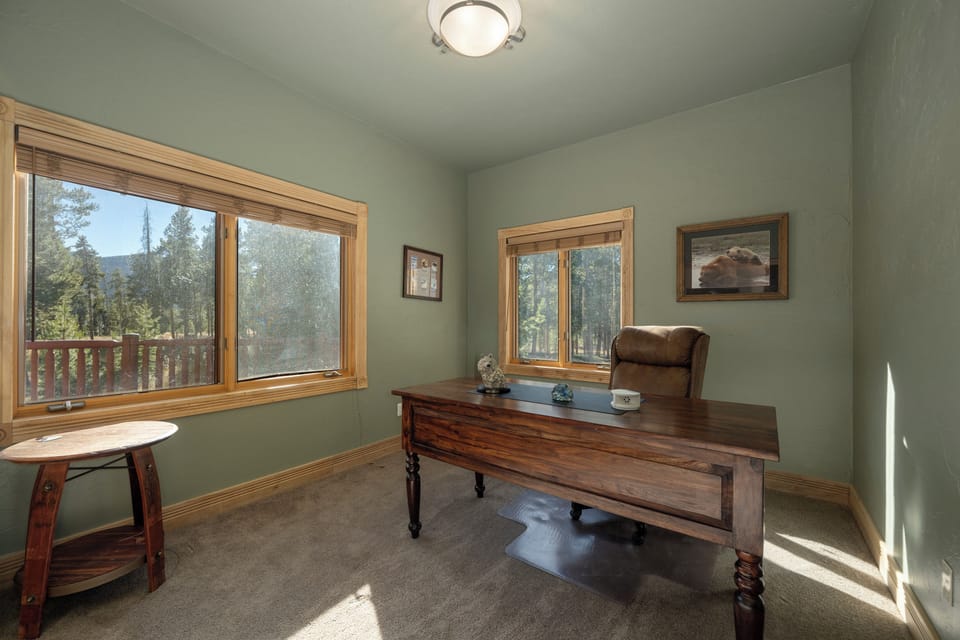 Work from your peaceful home office with forest views streaming through large windows, creating the perfect blend of productivity and tranquility.