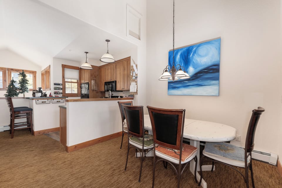 Your open-concept space flows seamlessly from dining to kitchen, perfect for intimate meals and culinary adventures together at Kicking Horse Palomino 7-302.