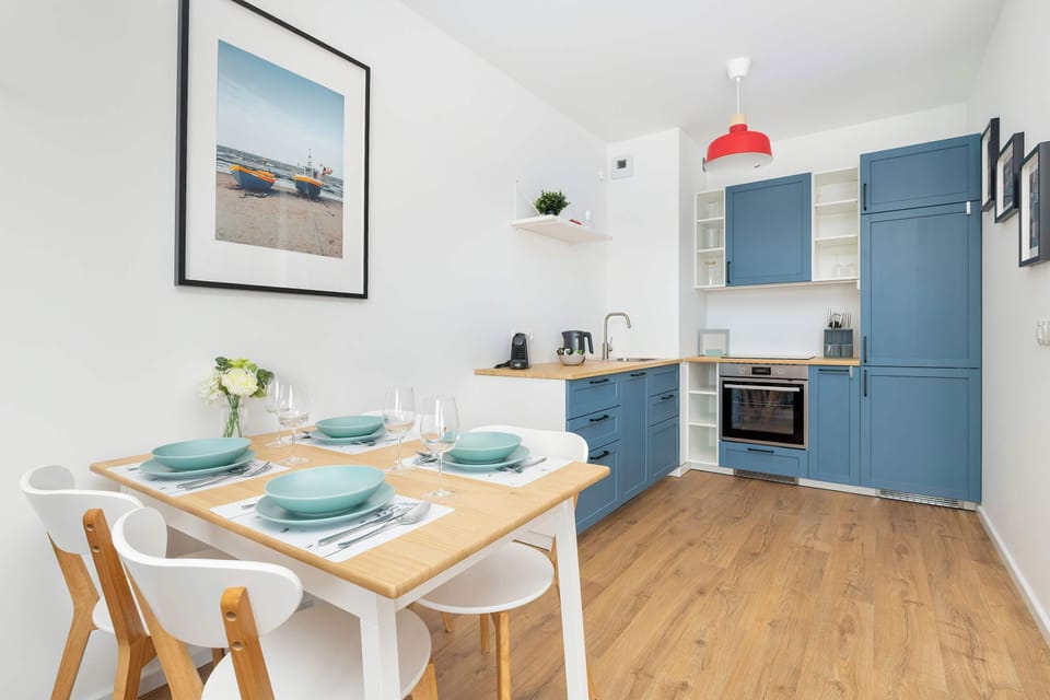 A charming kitchen with blue cabinets and a wooden countertop offers everything you need to prepare your favorite meals.
