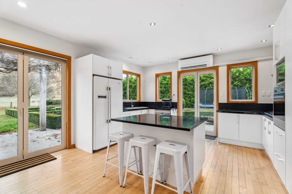 Modern kitchen with island bench and bar stools