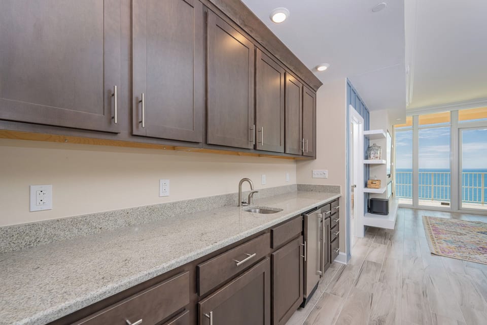 Grab a chilled drink from the fridge or create your favorite cocktail at the wet bar