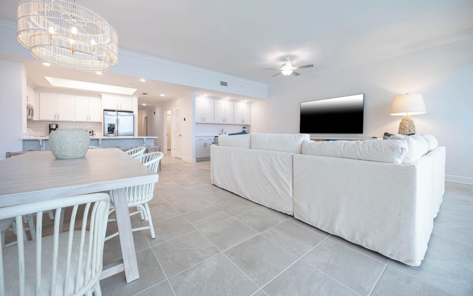 Relax on the cozy sofa with a queen sleeper in this inviting family room with breathtaking beachfront views