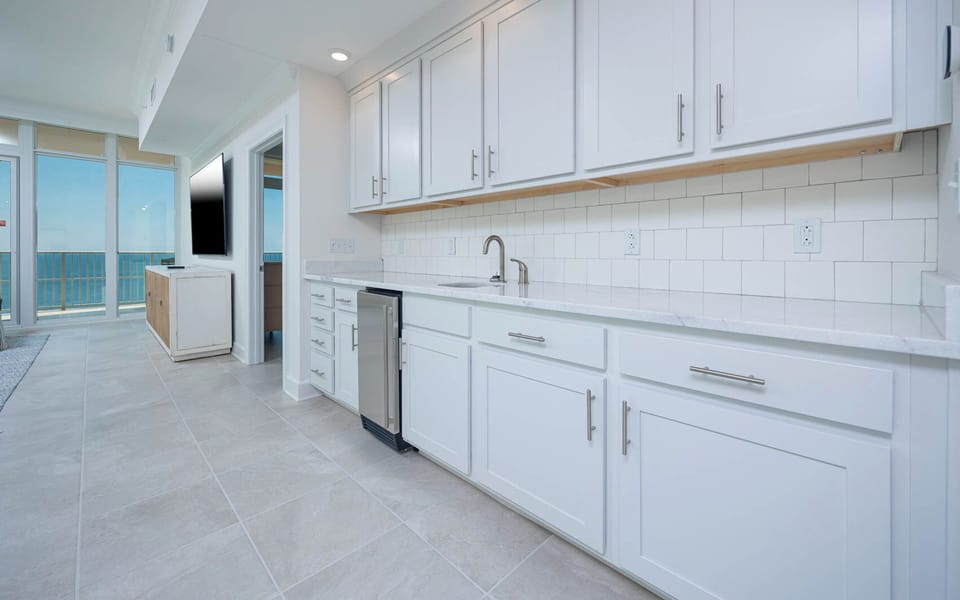 Grab a chilled drink from the fridge or create your favorite cocktail at the wet bar