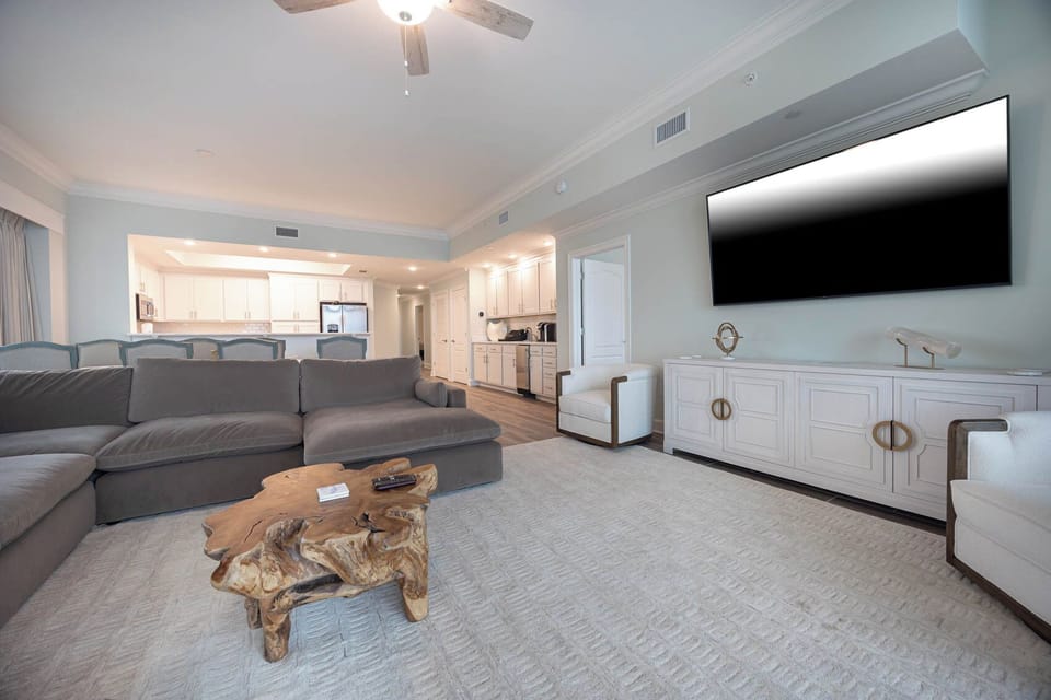 Gather in this welcoming living space and enjoy stunning beach views through the windows