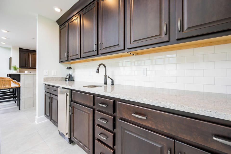 Grab a chilled drink from the fridge or create your favorite cocktail at the wet bar
