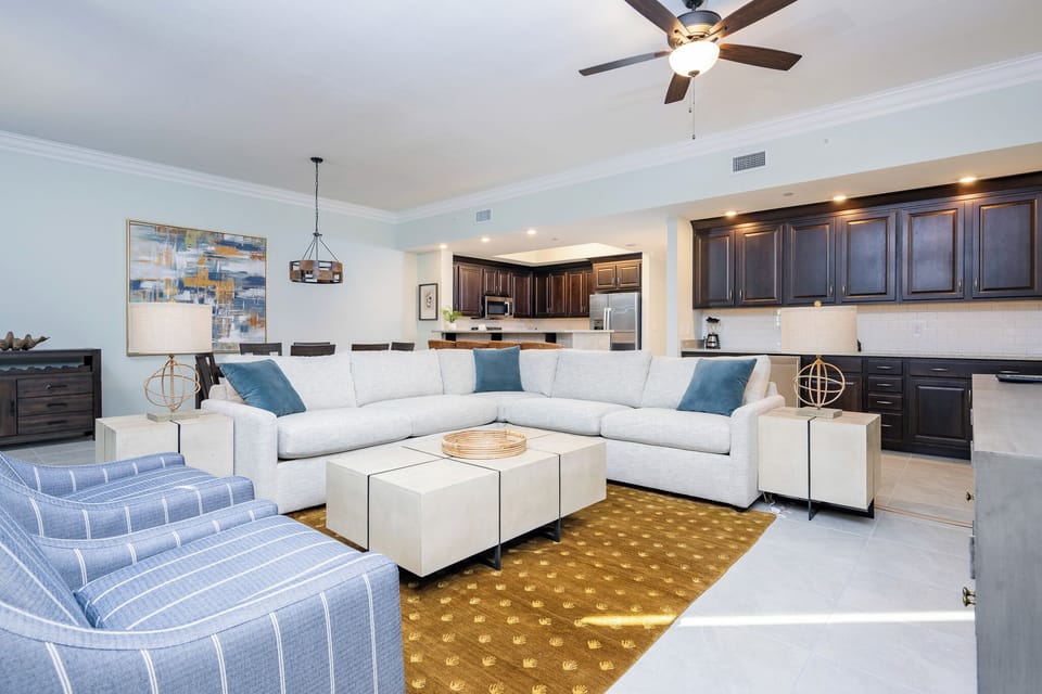 Relax on the cozy sofa with a queen sleeper in this inviting family room with breathtaking beachfront views