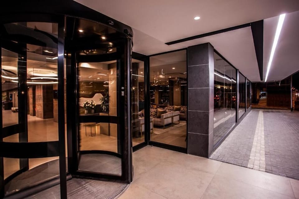 Arrive in style through the modern, well-lit hotel entrance.