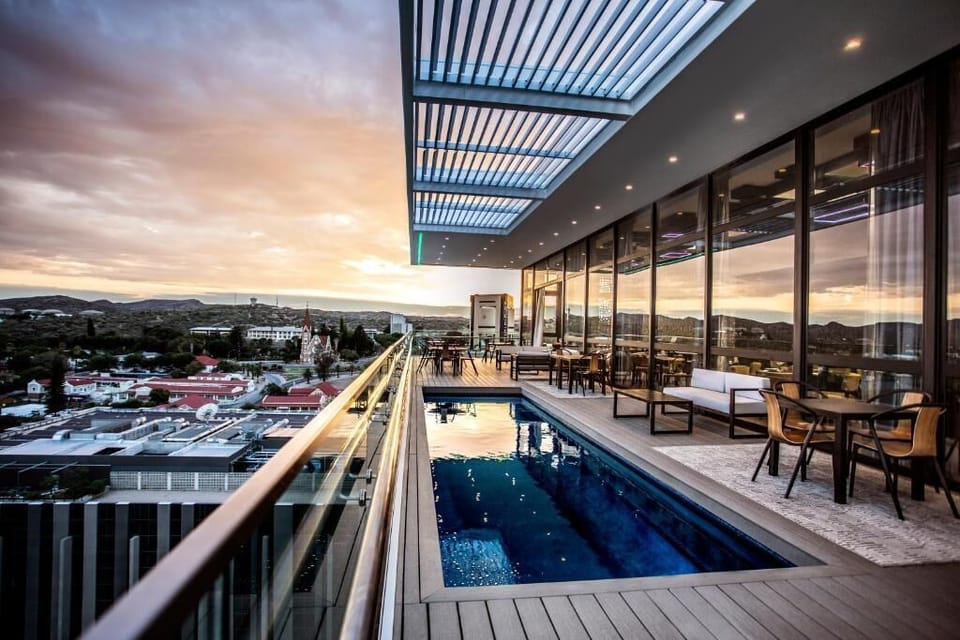 Soak up sunset skies beside the rooftop pool and lounge.