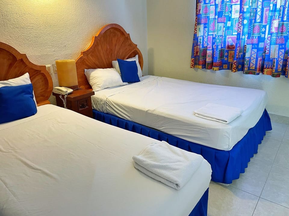 Drift off on neatly made beds with soft, plush towels.