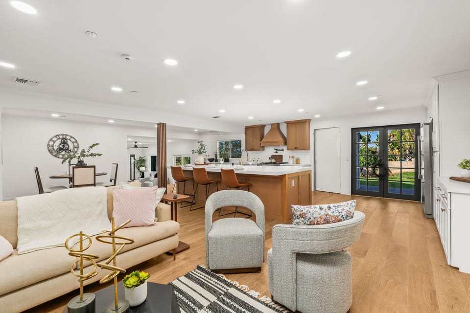 Spacious living area with comfortable seating and TV