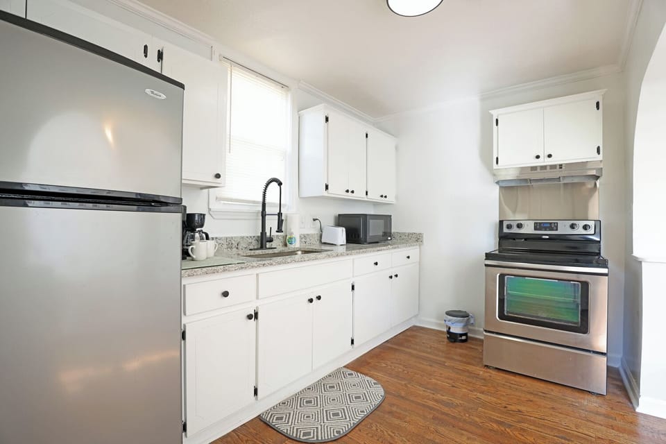 ful kitchen with pots and  utensils and  spatulas