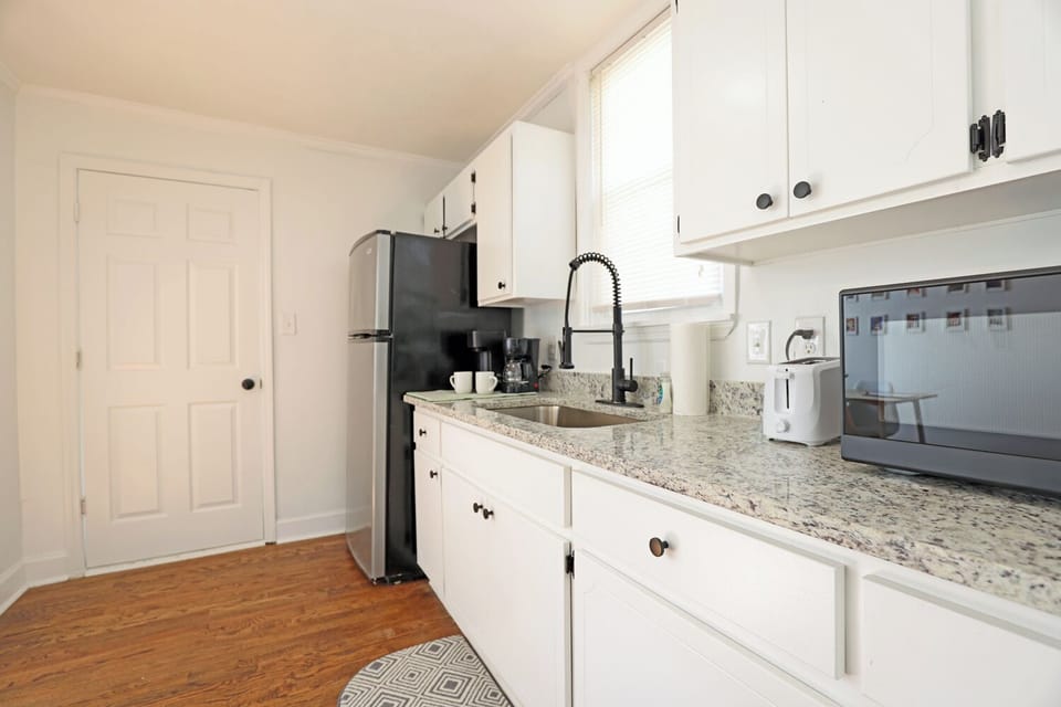More utensils , Spatulas , cooking vessels in these cabinets