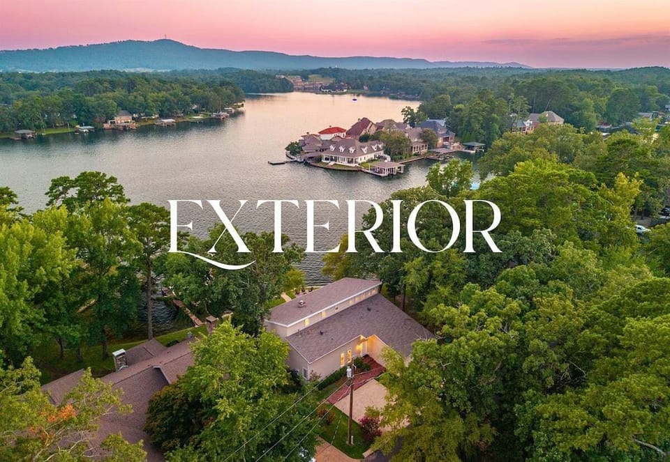 A dreamy aerial view of your lakeside getaway — tucked into nature, yet full of luxury.