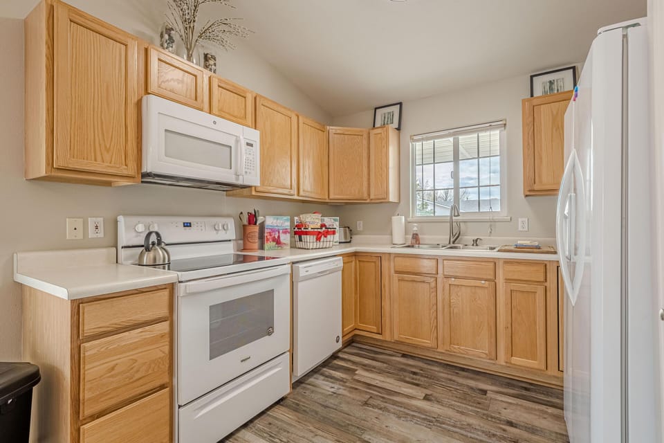 Bright, airy kitchen with ample storage and natural light