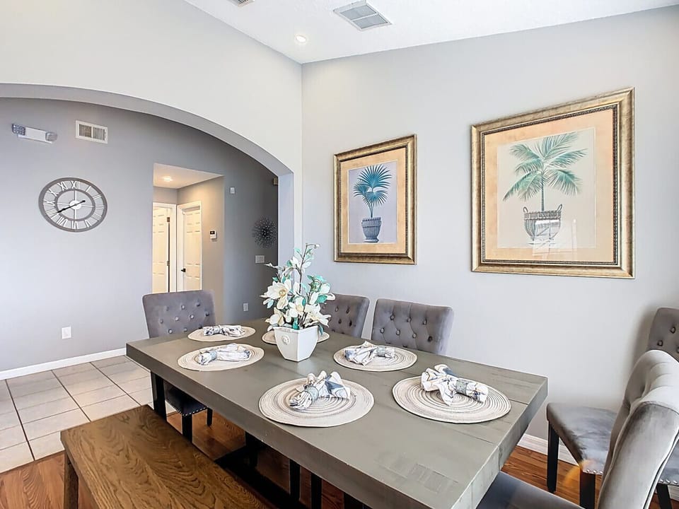 Tastefully decorated dining room with elegant table setting and natural light.