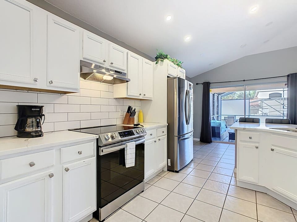 Spacious kitchen featuring stainless steel appliances and plenty of counter space.