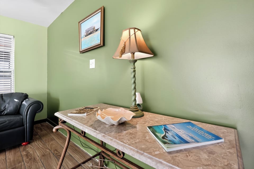 Stylish accent table with lamp and décor in the cozy living space.