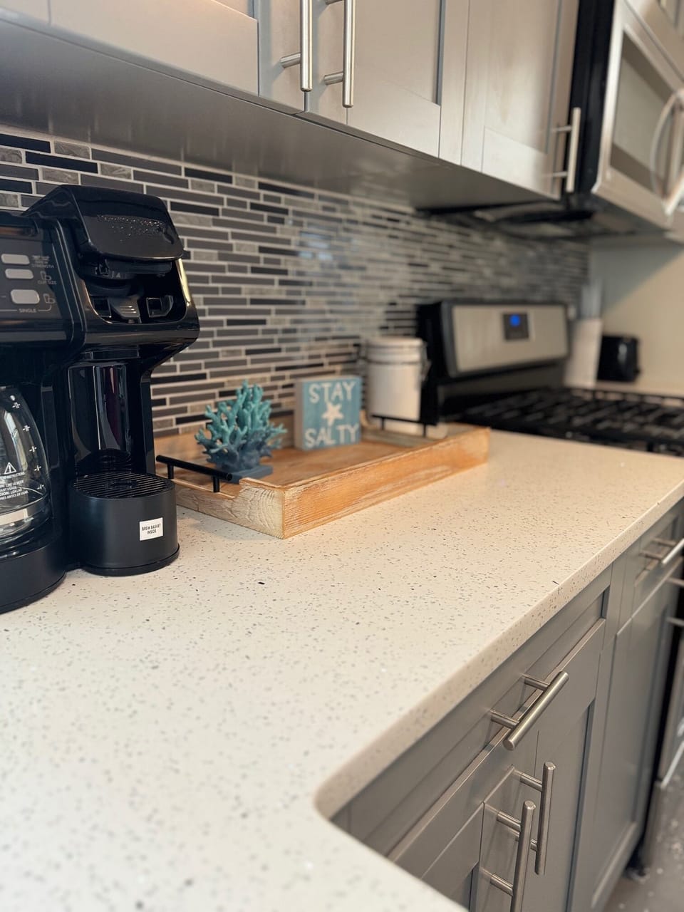 Coffee bar, stove, microwave, oven.  