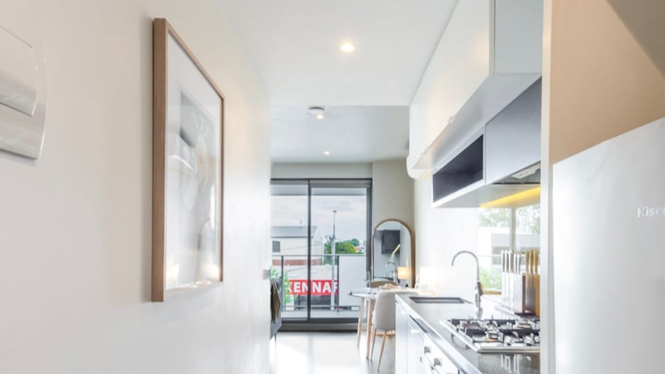 Open-plan kitchen, well-equipped for cooking or enjoying a snack at home.