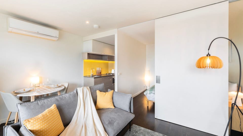 Bright and welcoming space with ample natural light, ideal for enjoying a meal or relaxing.