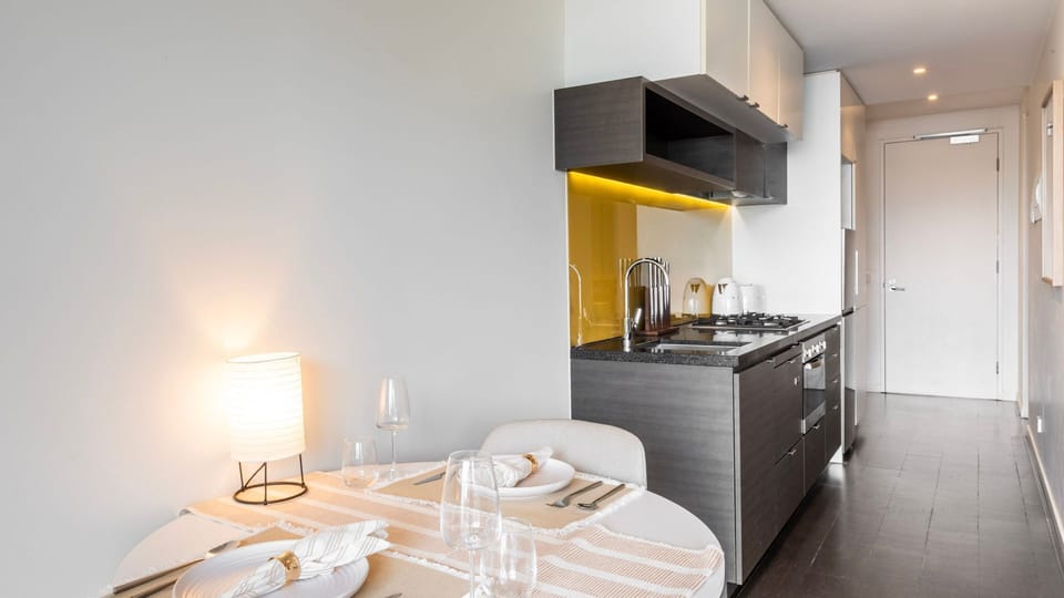 Spacious dining area with a table set for two, ideal for meals or planning your next adventure.