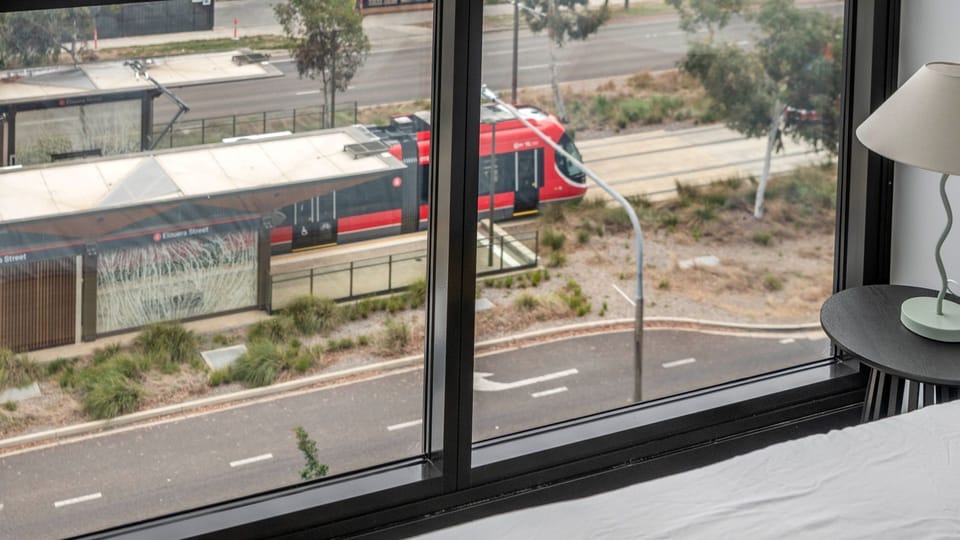 Large windows offering scenic views of the surrounding neighborhood