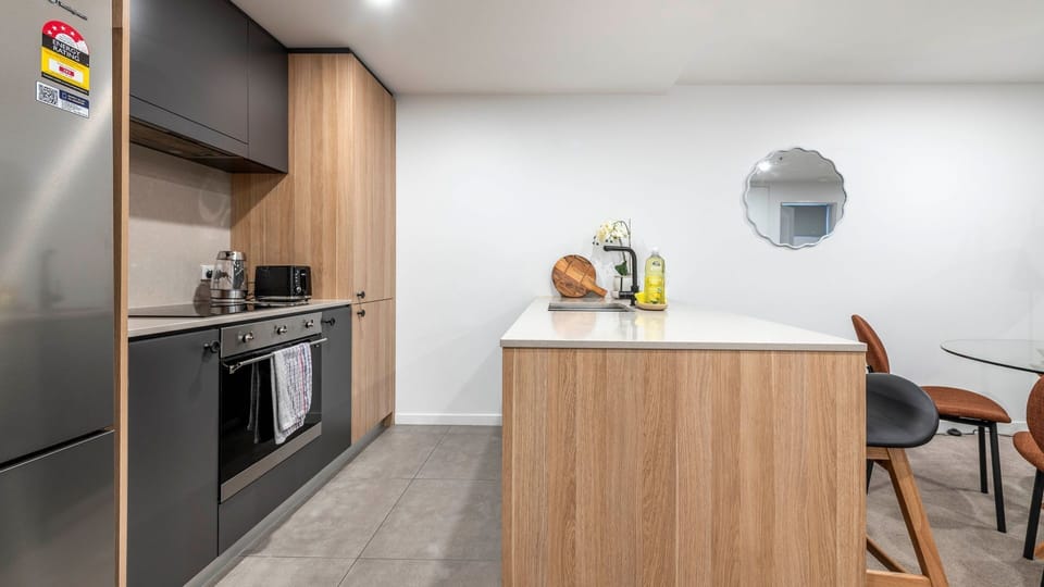 Fully equipped kitchen with stainless-steel appliances.