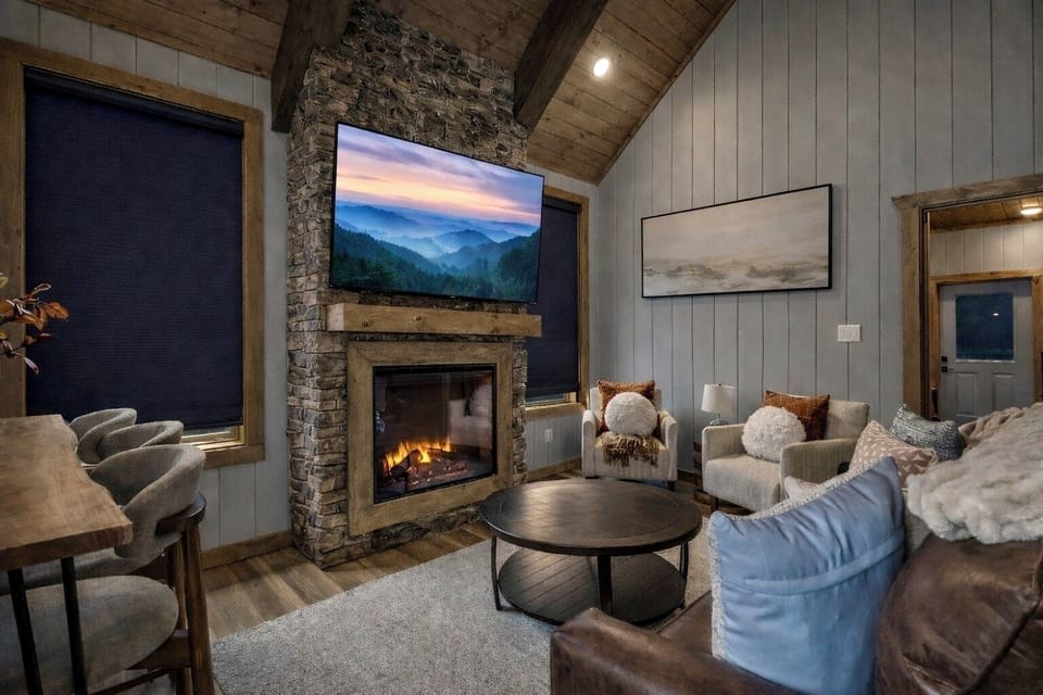 Cozy vaulted living space with electric fireplace