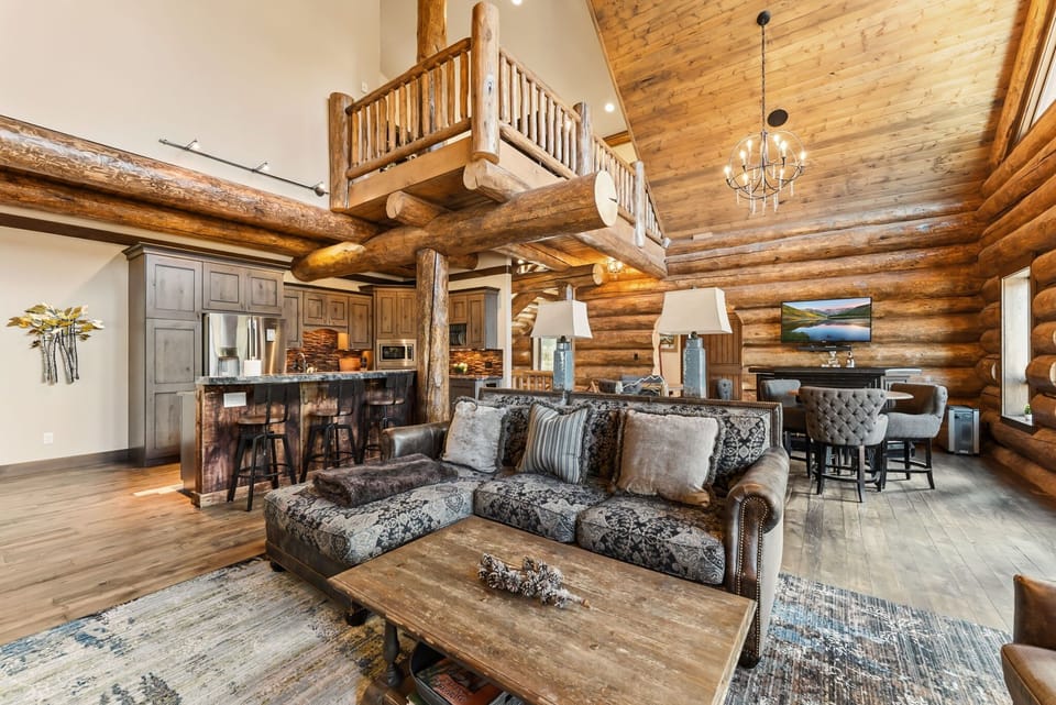 Living room: Vaulted ceilings, dining table, natural light