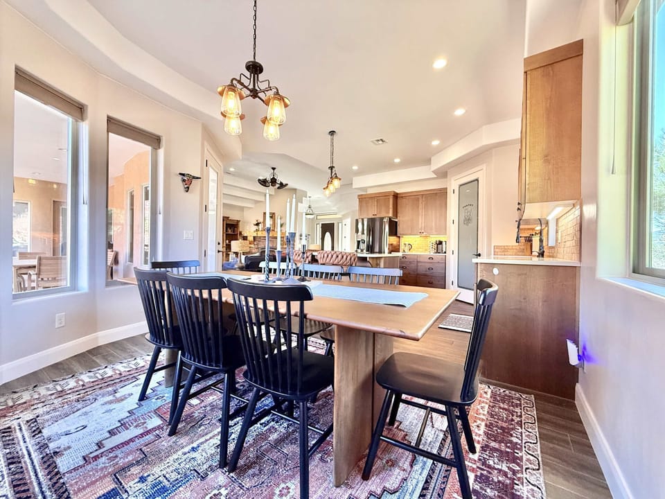 The dining area, kitchen, and living room are central to the open floor plan.