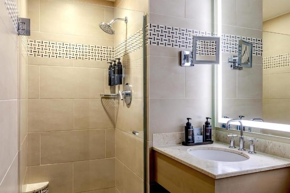 Refresh in a spotless bathroom with a walk-in shower.