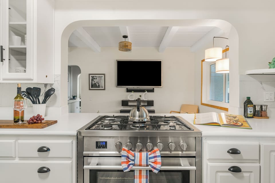 A fully equipped kitchen area with ample counter space for meal preparation.