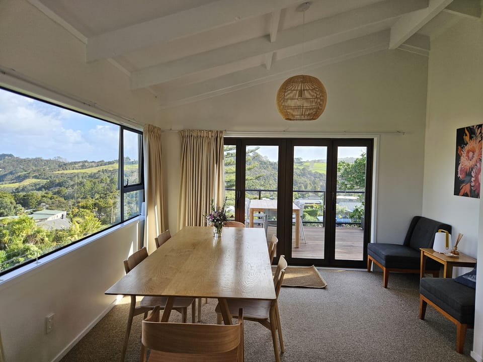Dining table with deck and view beyond