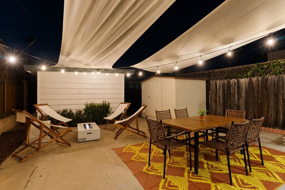 Gather, graze, and glow under this breezy canopy hangout