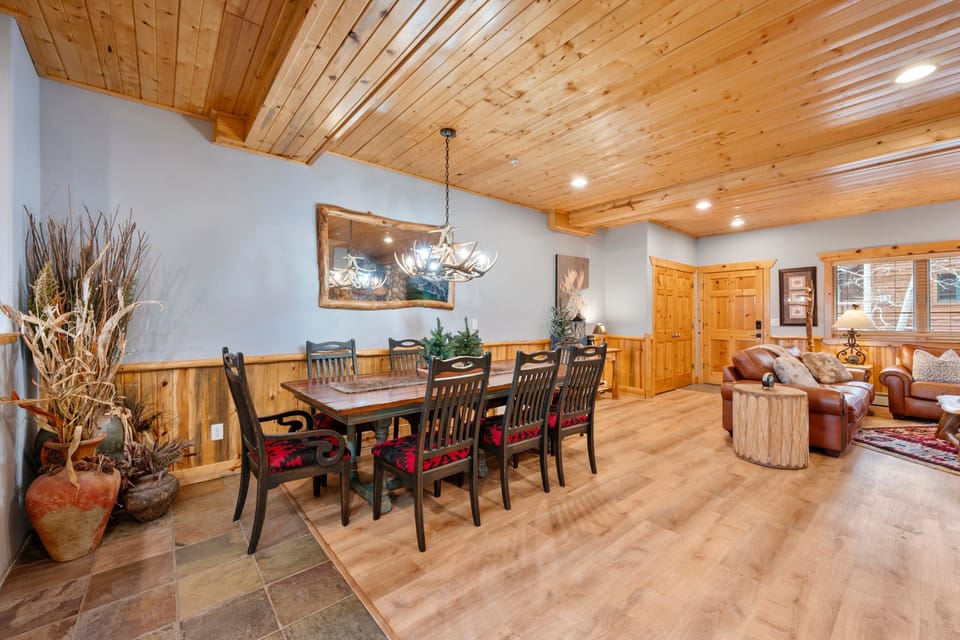 The large kitchen is fully equipped and includes a kitchen island with bar seating.