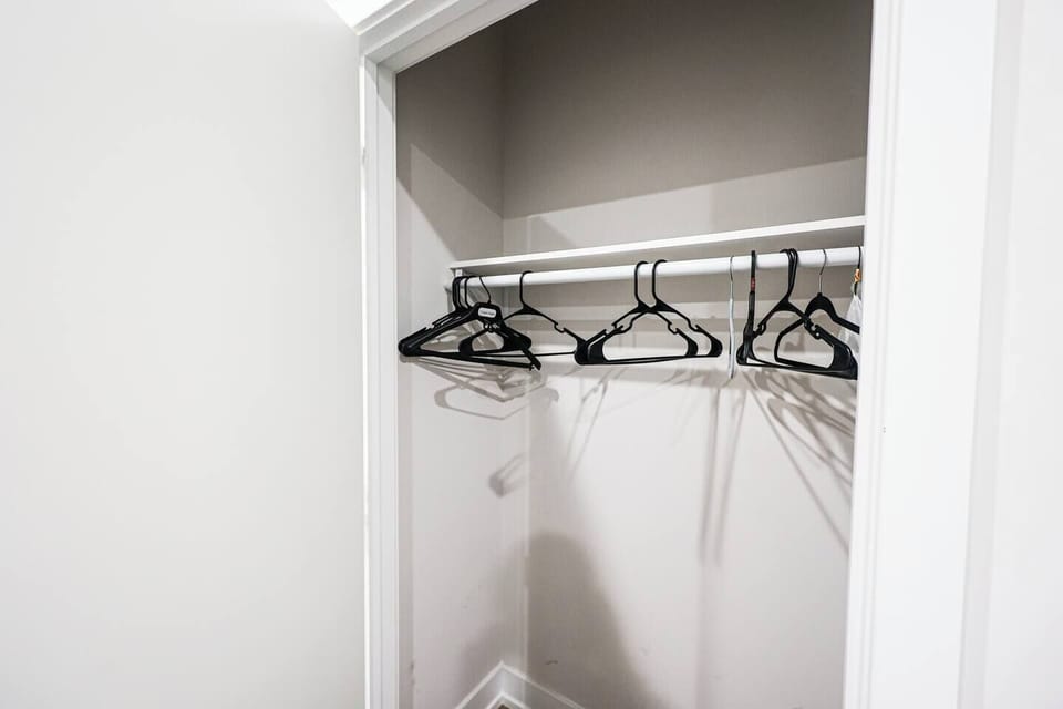 Walk-in closet with room for all your travel essentials #PackLight #GuestStorage