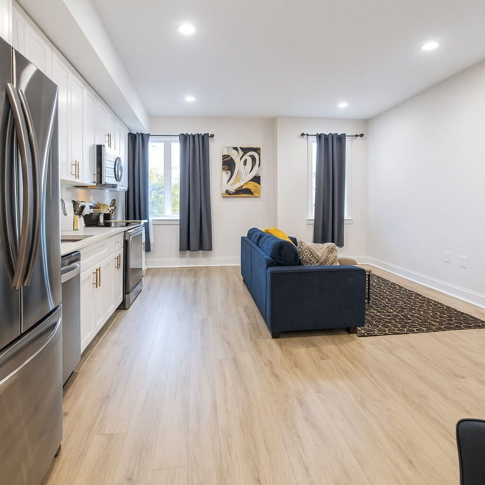 Modern living room with a comfy sofa and smart TV for movie nights.